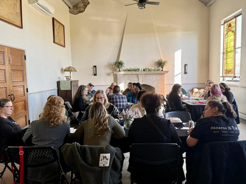Photo of group networking event in Bravo Room of Adrian Armory