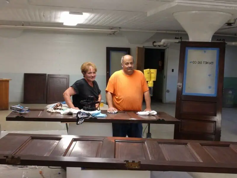 Mike and Diane Downard Restoring Doors Throughout the Building